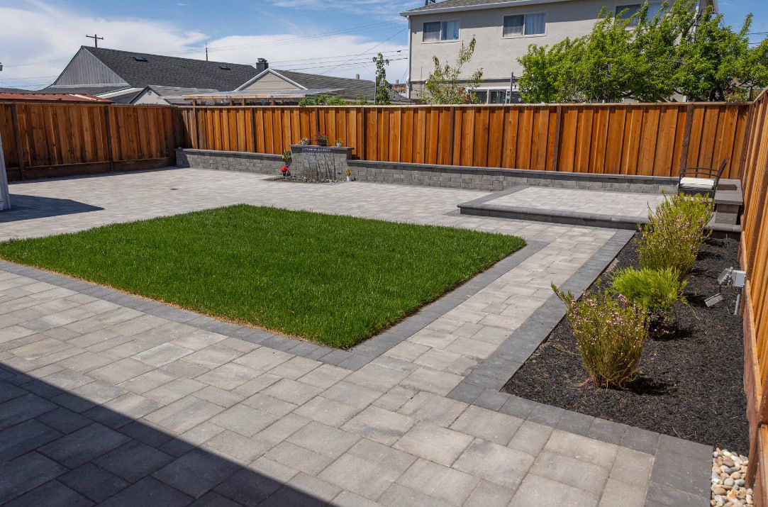 Full backyard renovation with pavers, lawn and planters by CIP Pavers in the Bay Area